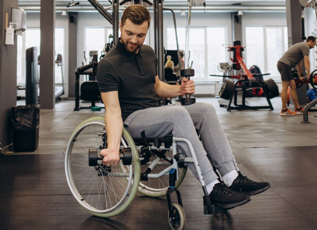 Image of a wheelchair user using our gym